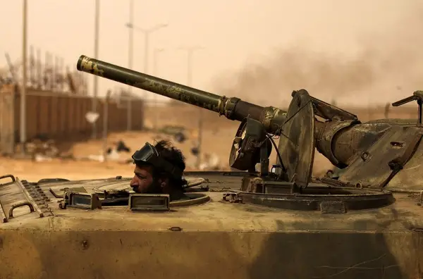 Rebels in the eastern Libyan town of Ajdabiyah are trying to fend off an attack by forces loyal to Colonel Gaddafi. The Libyan armed forces has been bombing the area on a regular basis, but has so far failed to dislodge the opposition rebels, who still patrol the streets. 