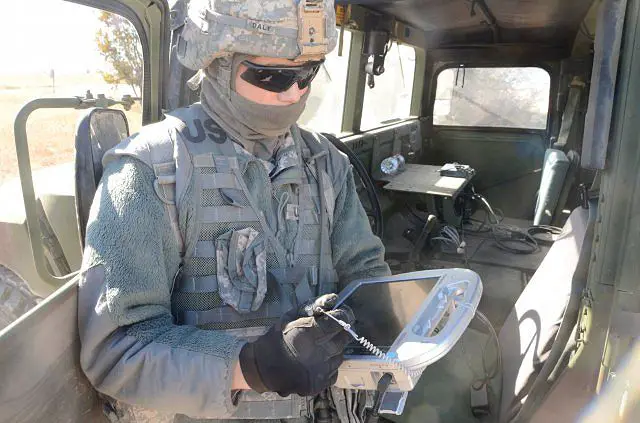 A U.S. Soldier from 3rd Cavalry Regiment programs an autonomous convoy using the Autonomous Mobility Appliqué System.