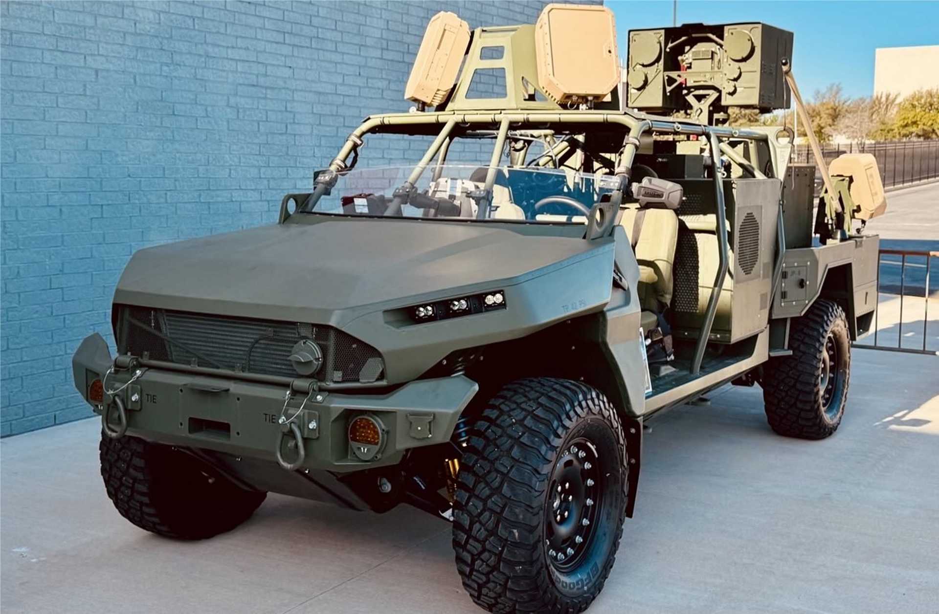 A U.S. Army M1301 Infantry Squad Vehicle fitted with the BlueHalo LOCUST high-energy laser weapon system is displayed during Fort Sill’s annual Fires Symposium in April 2025. The configuration highlights the Army’s effort to integrate mobile directed-energy counter-drone capabilities with maneuver formations. (U.S. Army photo)