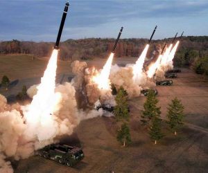 North Korea’s 600 mm multiple rocket launcher system fires a coordinated salvo during a previous military exercise. The September 12, 2026 launches may have involved both Hwasong-11-series short-range ballistic missiles and 600 mm guided rockets, highlighting the potential missile-saturation challenge facing U.S., South Korean and Japanese air and missile defenses.