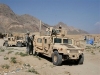 US Army Humvee light wheeled vehicle picture. U.S. soldiers stand near an armored Humvee vehicle in Tagab district of Kapisa province, north of Kabul, Afghanistan on Thursday, Sept. 27, 2007. The U.S. military has launched a new 'Most Wanted' campaign offering rewards of up to US$200,000 for information leading to the capture of 12 Taliban and al-Qaida leaders. Posters and billboards are being put up around eastern Afghanistan with the names and pictures of the 12, with reward amounts ranging from US$20,000 to US$200,000. The list is filled with local insurgent cell leaders responsible for roadside and suicide bomb attacks.