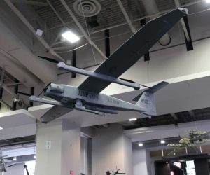 AeroVironment drones displayed at the company's booth during AUSA 2026 in Washington, D.C., highlighting the Pentagon's ambition to invest approximately $50 billion in scaling autonomous weapons production from thousands to potentially millions of systems.