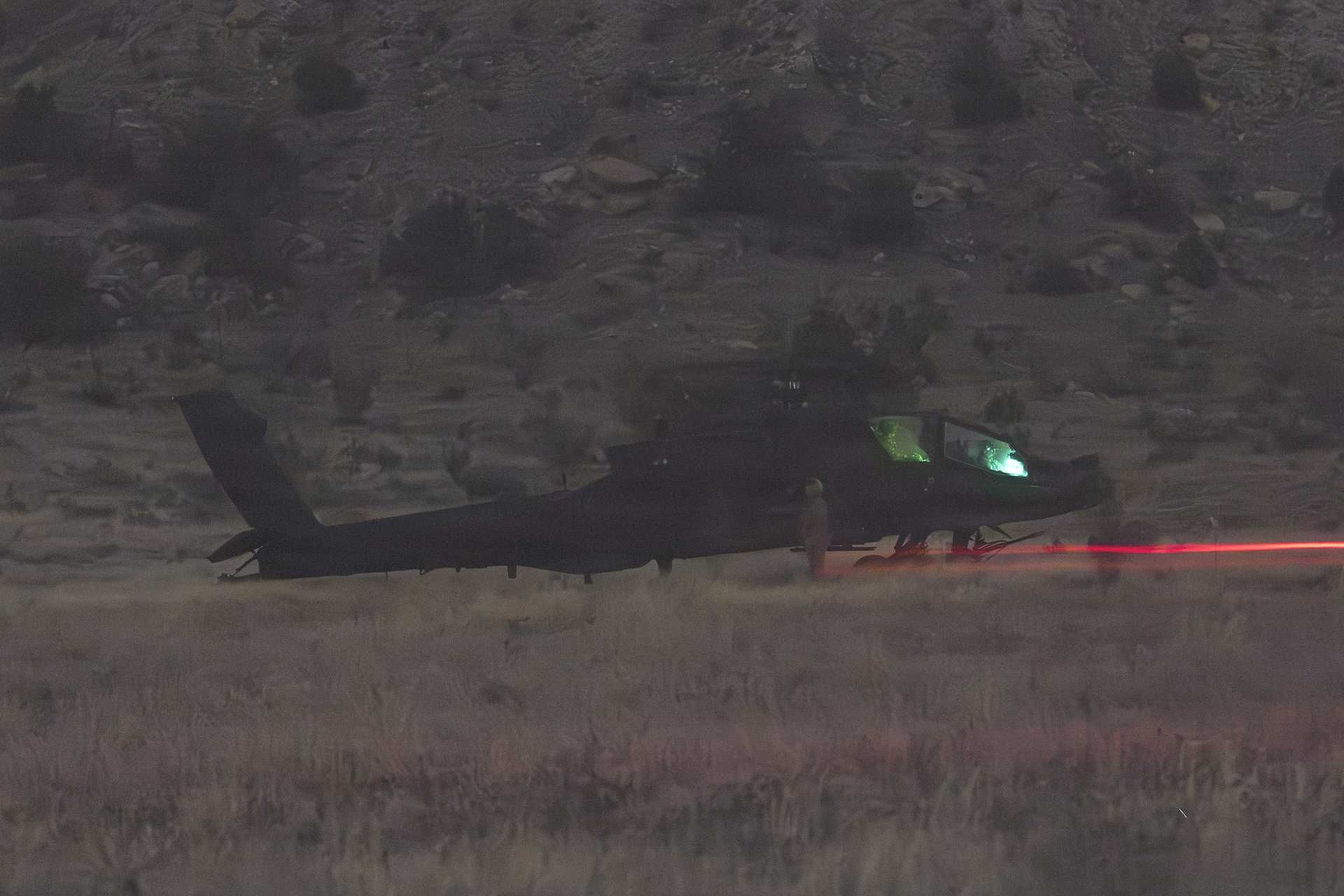 A U.S. Army AH-64 Apache attack helicopter assigned to the 4th Combat Aviation Brigade, 4th Infantry Division, approaches a forward arming and refuel point during Exercise Ivy Mass at Fort Carson, Colorado, on May 12, 2026, as the U.S. Army tests Next-Generation Command and Control capabilities for future large-scale combat operations.