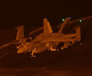 U.S. Navy imagery shows an F/A-18E Super Hornet aboard USS George Washington apparently carrying two SLAM-ER-family missiles, underscoring the carrier air wing’s long-range precision-strike capability in the U.S. 5th Fleet area (Picture Source: U.S. Navy)