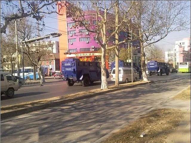 A picture take in China shows a convoy of anti-riot armoured vehicle on the way to be transfer in Africa. On the sides of the vehicles it is written "Uganda Police". 