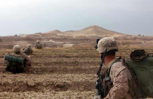 Marines with Fox Company, 2nd Battalion, 4th Marine Regiment, rest during a movement from Patrol Base 7171 to another position to begin their participation in the second phase of Operation Double Check, a battalion-level offensive to rid areas of southern Musa Qal’eh district of insurgents