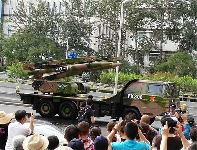 The HQ-12 is a surface-to-air defense missile system also known as its export name of KaiShan 1A or KS-1A. The vehicle is equipped with two missiles ready to fire.