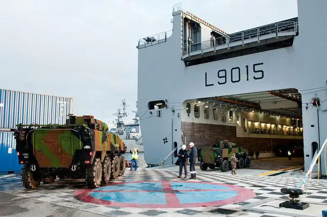 French VBCI wheeled armoured infantry fighting vehicle are loaded on the Dixmude ship of the French Navy, Sunday, January 20, 2013.
