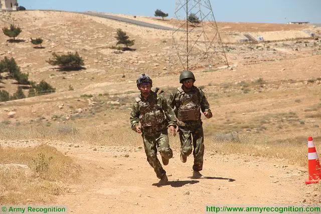 Kazakhstan team run during the "Soul Crusher" event at the Warrior Competition 2016 in KASOTC Special Forces training center near Amman, Jordan. 