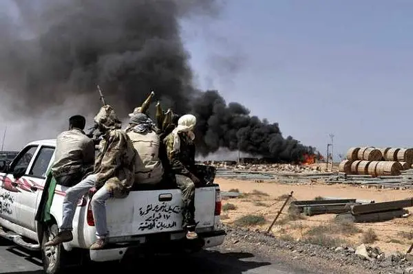 Libyan Rebel forces bore down Monday on Moammar Gadhafi's hometown of Sirte, a key government stronghold where a brigade headed by one of the Libyan leader's sons was digging in to defend the city and setting the stage for a bloody and possibly decisive battle.