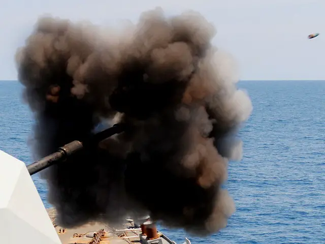 HMS Liverpool returns fire on Libyan shore batteries using her 4.5in main gun.