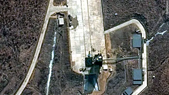 A new satellite image has captured increased activity on North Korea's launch pad as the country prepares for its controversial missile launch in mid-April. The DigitalGlobe image taken on March 28 shows trucks on the Tongch'ang-ni launch pad. Atop the umbilical tower, which sits beside where the assembled rocket will stand, a crane arm that will be used to lift the rocket stages has been swung wide