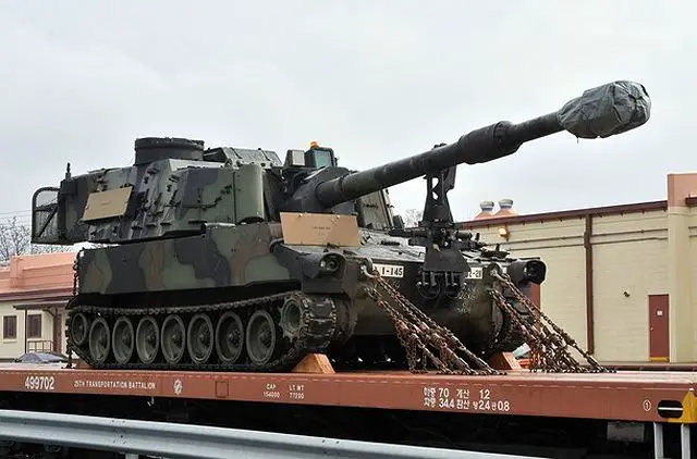 United States Army M109A6 Paladin 155mm Howitzer is bound on a train during a railhead operation of prepositioned equipment at Camp Carroll in Chilgok, 220 kms southeast of Seoul, 