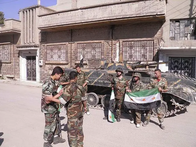 Syrian army soldiers defected the national army to join the free Syrian army with armoured infantry fighting vehicle BMP-1 and light combat vehicles at Khaldiyeh neighborhood, in Homs province, central Syria. 