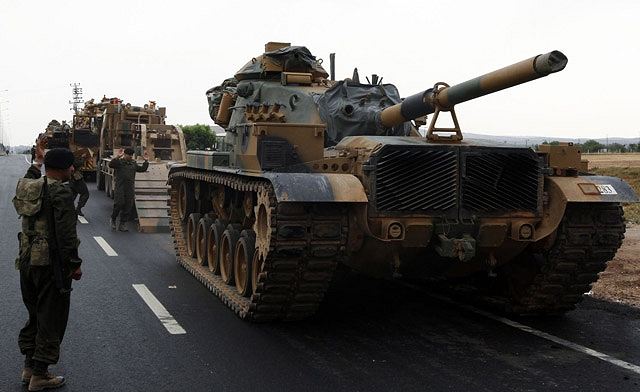 Turkey bolstered military presence on the border with Syria by deploying 250 tanks and 55 jets of various models on Friday, October 12, 2012, after a Syrian military helicopter bombed the Syrian border town of Azmarin.