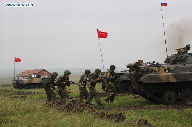 Chinese and Russian troops conducted their first joint exercises using live ammunition during anti-terrorism drill Peace Mission-2013 on Friday, August 10, 2013. The joint maneuvers were carried out at the Chebarkul combined training range here in Russia's Ural Mountains.