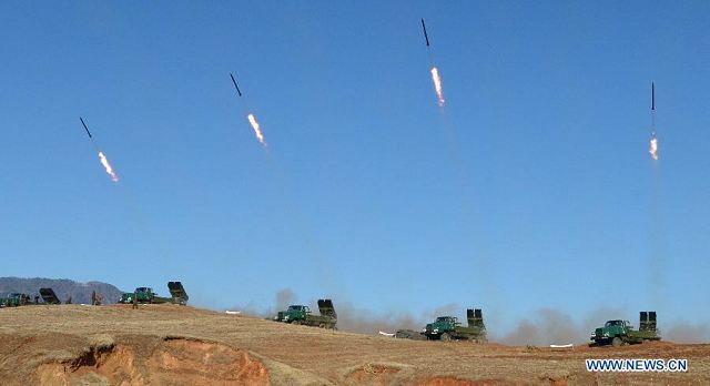 The undated photo provided by Korean Central News Agency (KCNA) on March 14, 2013 shows a live artillery drill of the Democratic People's Republic of Korea (DPRK) at the southwest sector of the front line.