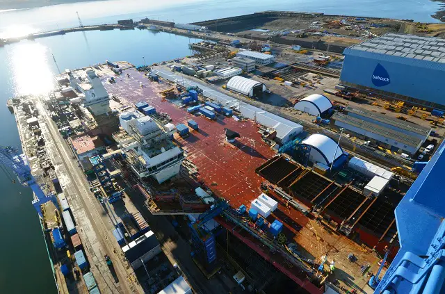 WORKERS at the Aircraft Carrier Alliance celebrated the creation of the UK’s biggest ever aircraft carrier as the final piece of the hull’s main structure was lowered into place yesterday (November 10). Under the watchful eye of shipyard workers the Goliath crane gently manoeuvred the very front part of the aircraft ramp or ‘ski-jump’ of HMS Queen Elizabeth into place.