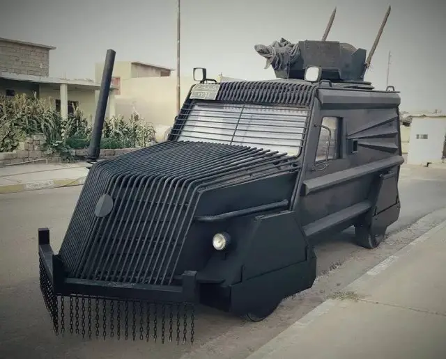 Kurdish troops prepare their Batmobile-style armoured-car for Mosuls battle 001