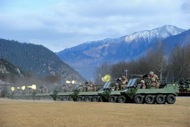 Chinese soldiers perform live fire training exercise with new 8x8 all-terrain vehicles called Lynx at an undisclosed area in the Tibet Autonomous Region on January 3, 2016. These Chinese soldiers are assigned to a brigade of the PLA (People's Liberation Army) Tibet Military Command. 