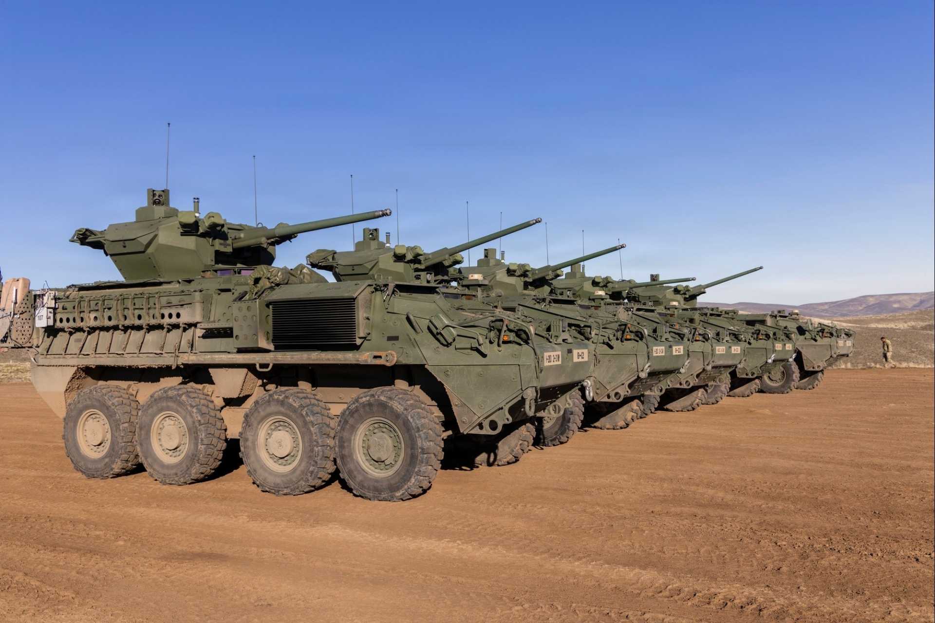 New M1126 Stryker combat vehicles equipped with 30mm automatic cannons, assigned to 2nd Battalion, 3rd Infantry Regiment, 1-2 Stryker Brigade Combat Team, line up in preparation for the next live-fire iteration at Yakima Training Center, Washington, December 13, 2025.