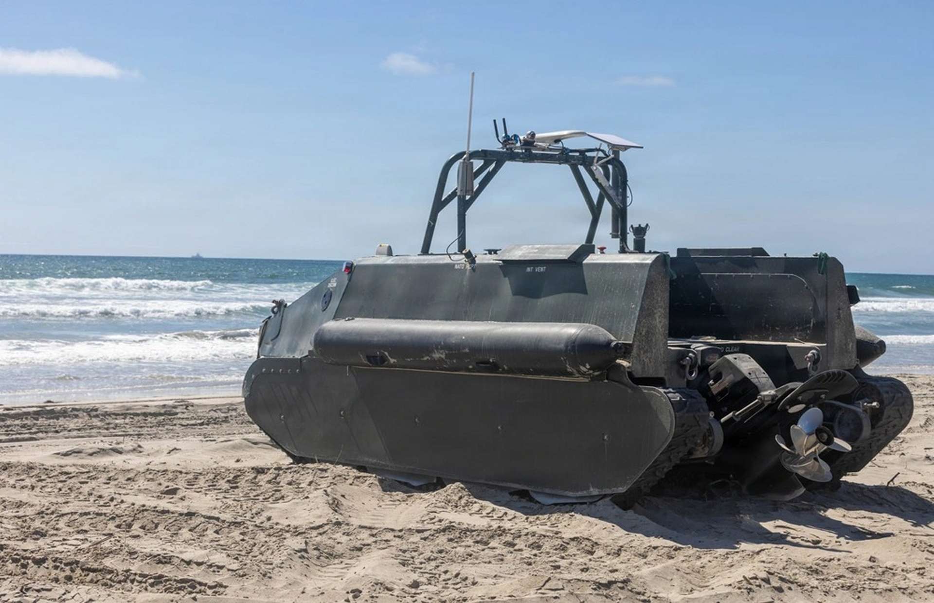 Unmanned tracked amphibious craft for surf zone operations, using swarming and remote control to detect, mark, and report mines, opening safer beach lanes for Marines( Picture source: U.S. DoW).
