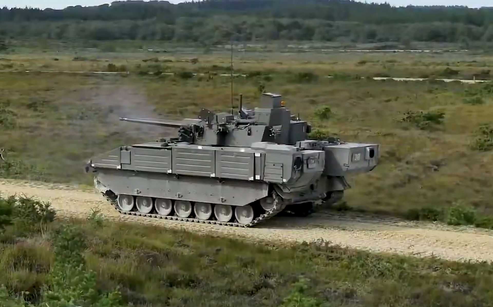 British Army crew members conduct live-fire gunnery training aboard the Ajax reconnaissance vehicle at Lulworth Ranges, showcasing the vehicle’s advanced CT40 cannon and fully digitized fire control systems during troop leader certification drills, November 2025.