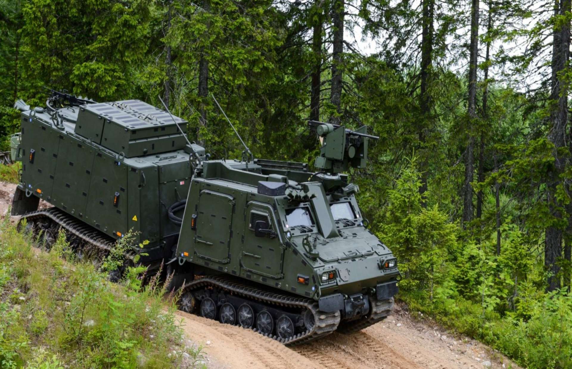 The BvS10 Sindhu is an articulated, amphibious all-terrain armored carrier that uses low-pressure tracks and a high-altitude diesel engine to move troops and mission payloads across deep snow, glaciers, soft sand, and flooded marshes up to 18,000 feet (Picture source: BAE Systems).