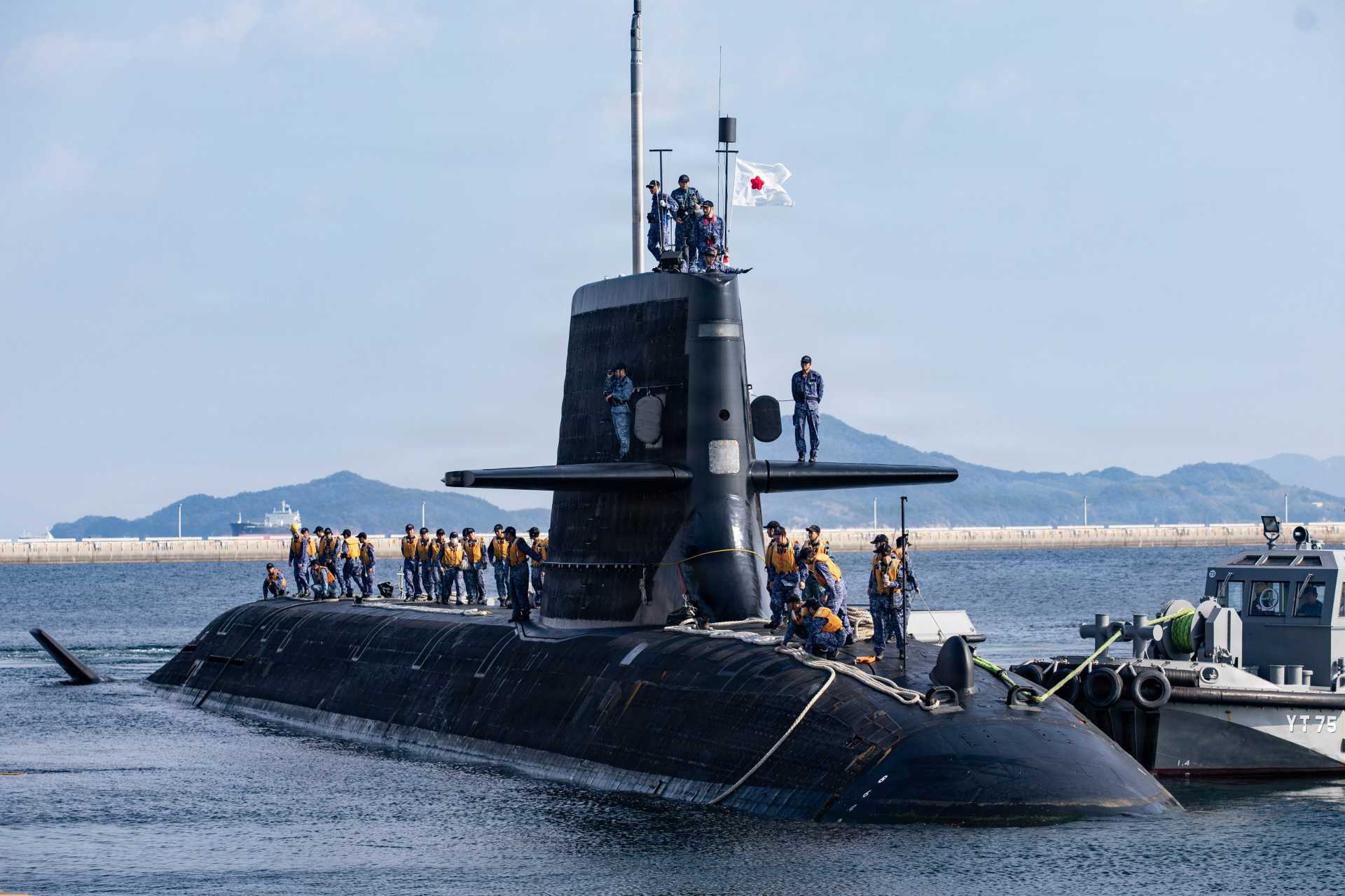 The Japan Maritime Self-Defense Force submarine JS Unryū (SS-502), assigned to Submarine Division 5 of the Fleet Submarine Force based in Funakoshi, arrives at Marine Corps Air Station Iwakuni, Japan, to conduct a resupply operation, October 27, 2025.