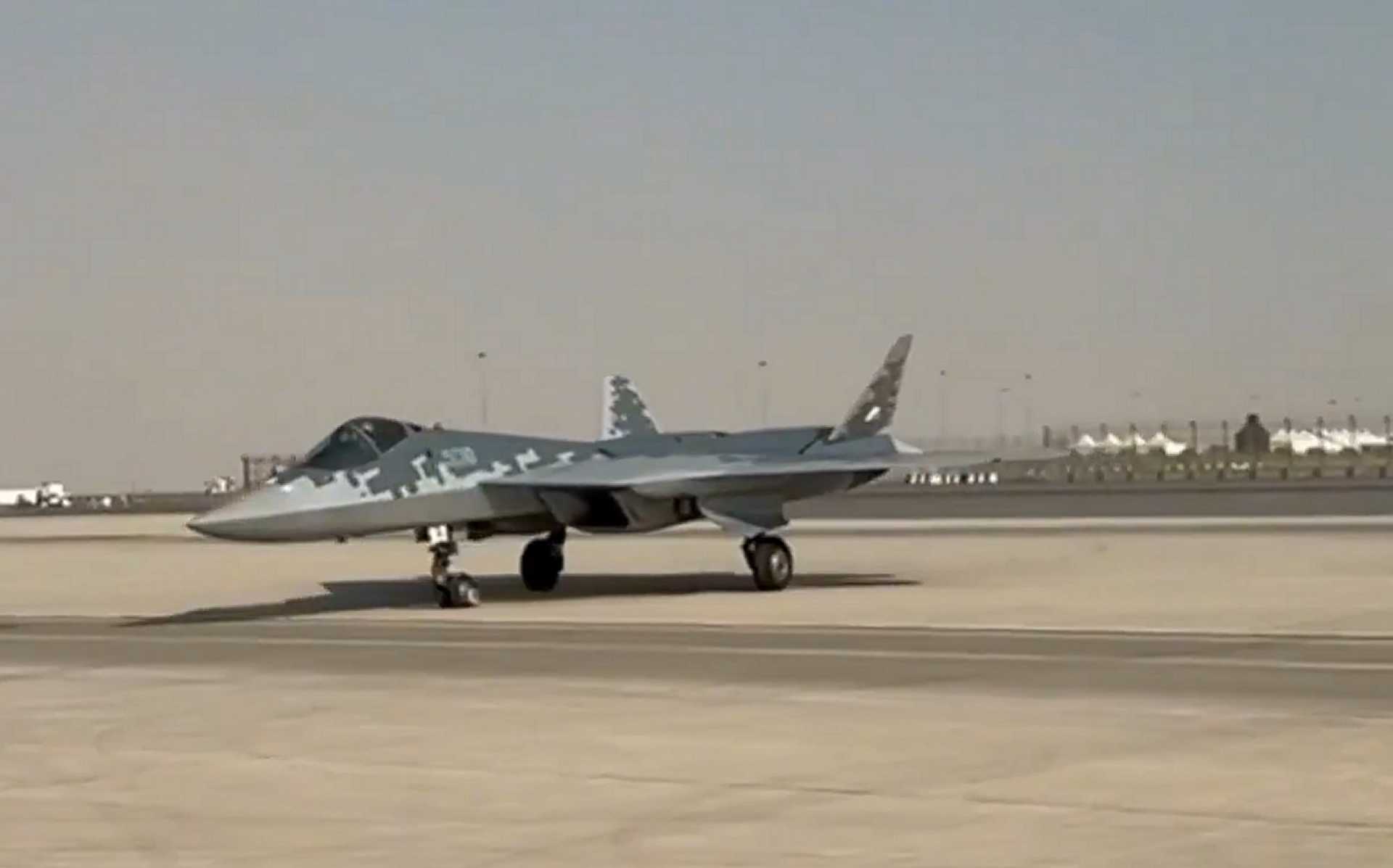 The Russian Su-57E fifth-generation stealth fighter taxiing on the runway at Dubai World Central during its debut arrival at Dubai Airshow 2025, marking the platform's first public appearance in the Middle East.
