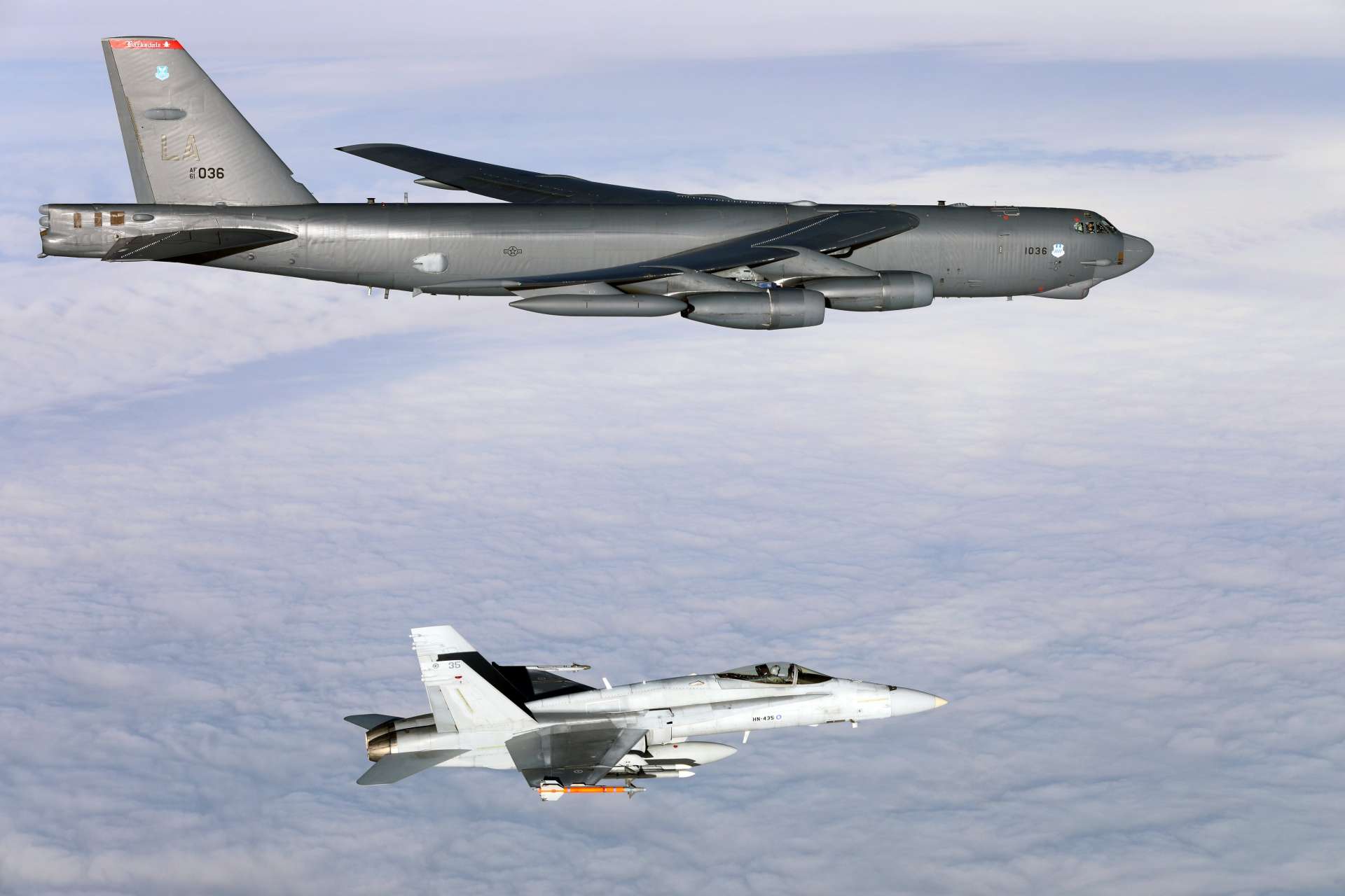 A U.S. Air Force B-52H Stratofortress flying from Spain teamed up with Finnish F/A-18 Hornet fighters over Finland, combining long range strike power with agile local air cover in NATO’s Arctic neighborhood (Picture Source: U.S. Air Force)