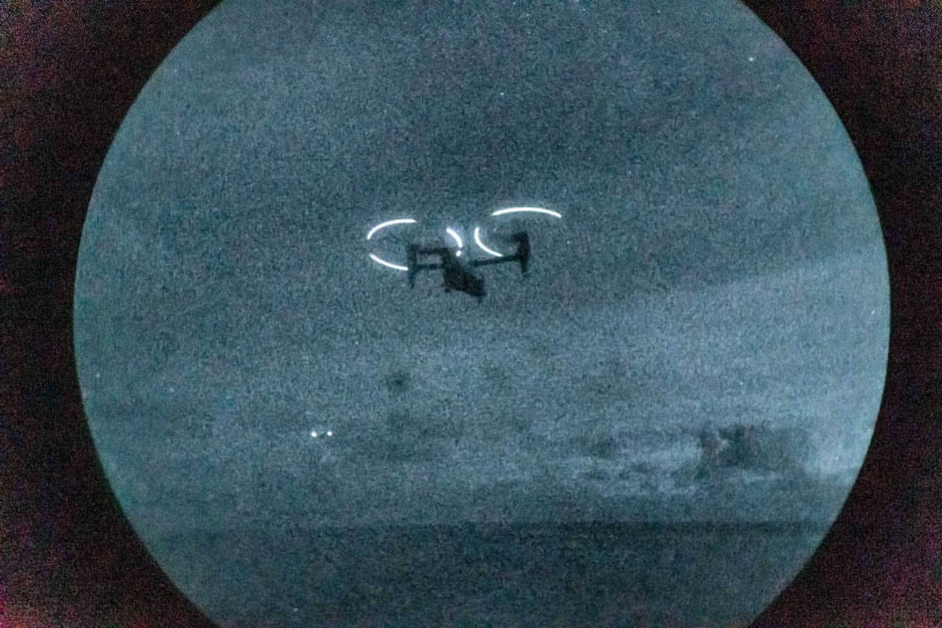 Night-vision view of a U.S. Marine Corps MV-22B Osprey conducting night flight operations from USS Iwo Jima in the Caribbean Sea