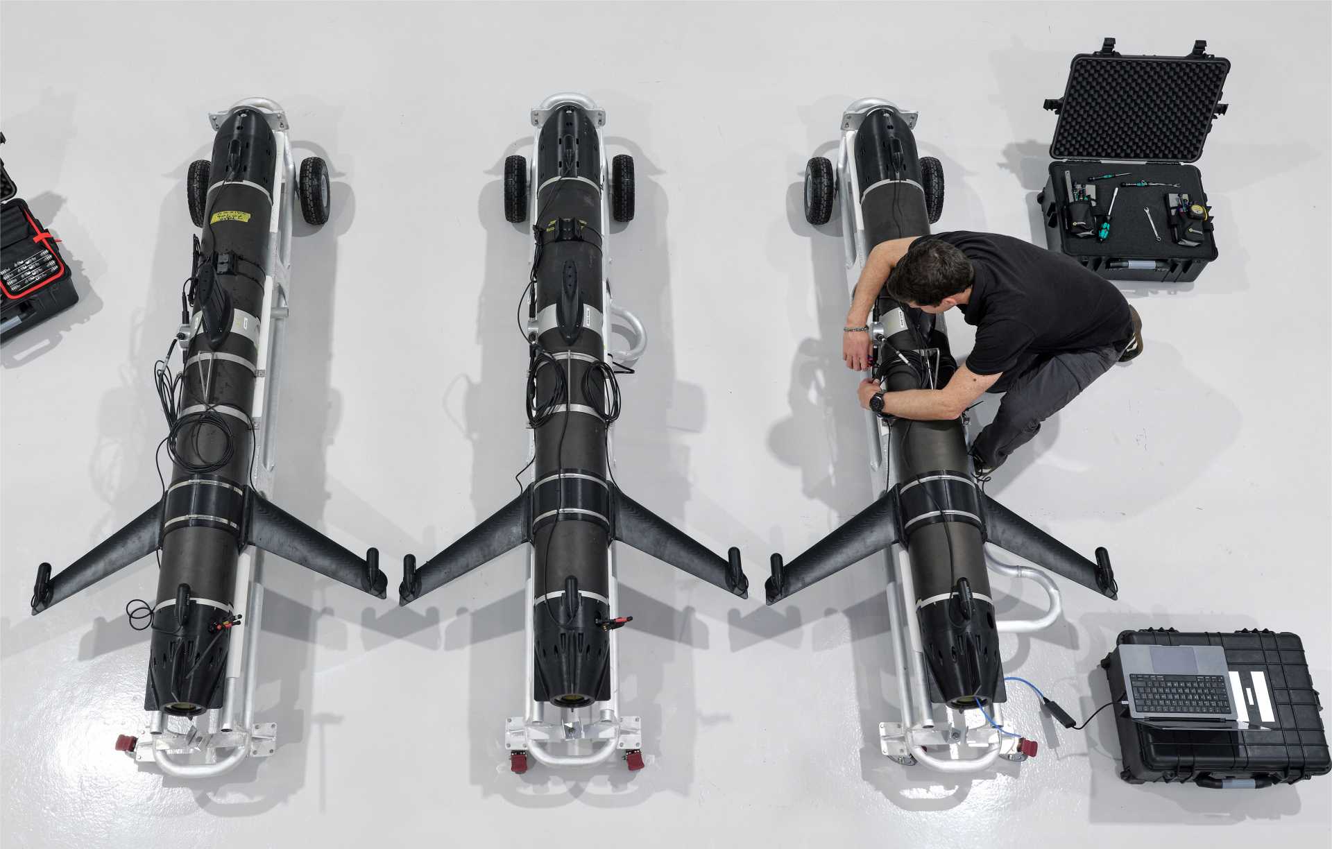 Engineers assemble SG-1 Fathom autonomous underwater gliders at a Helsing Resilience Factory in the UK, showcasing sovereign manufacturing of next-generation maritime surveillance systems for the British Royal Navy.