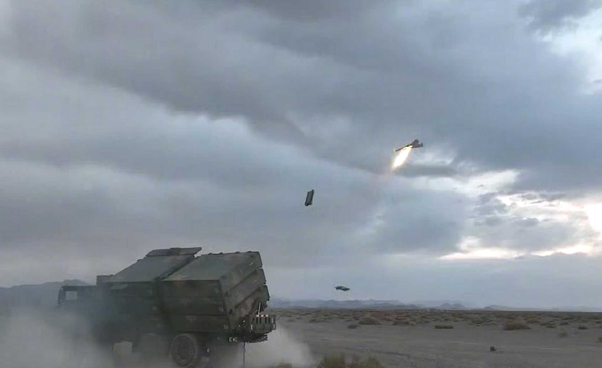 The Chinese PLA Eastern Theater Command conducts a live-fire test of the ASN-301 loitering munition from a mobile launcher.