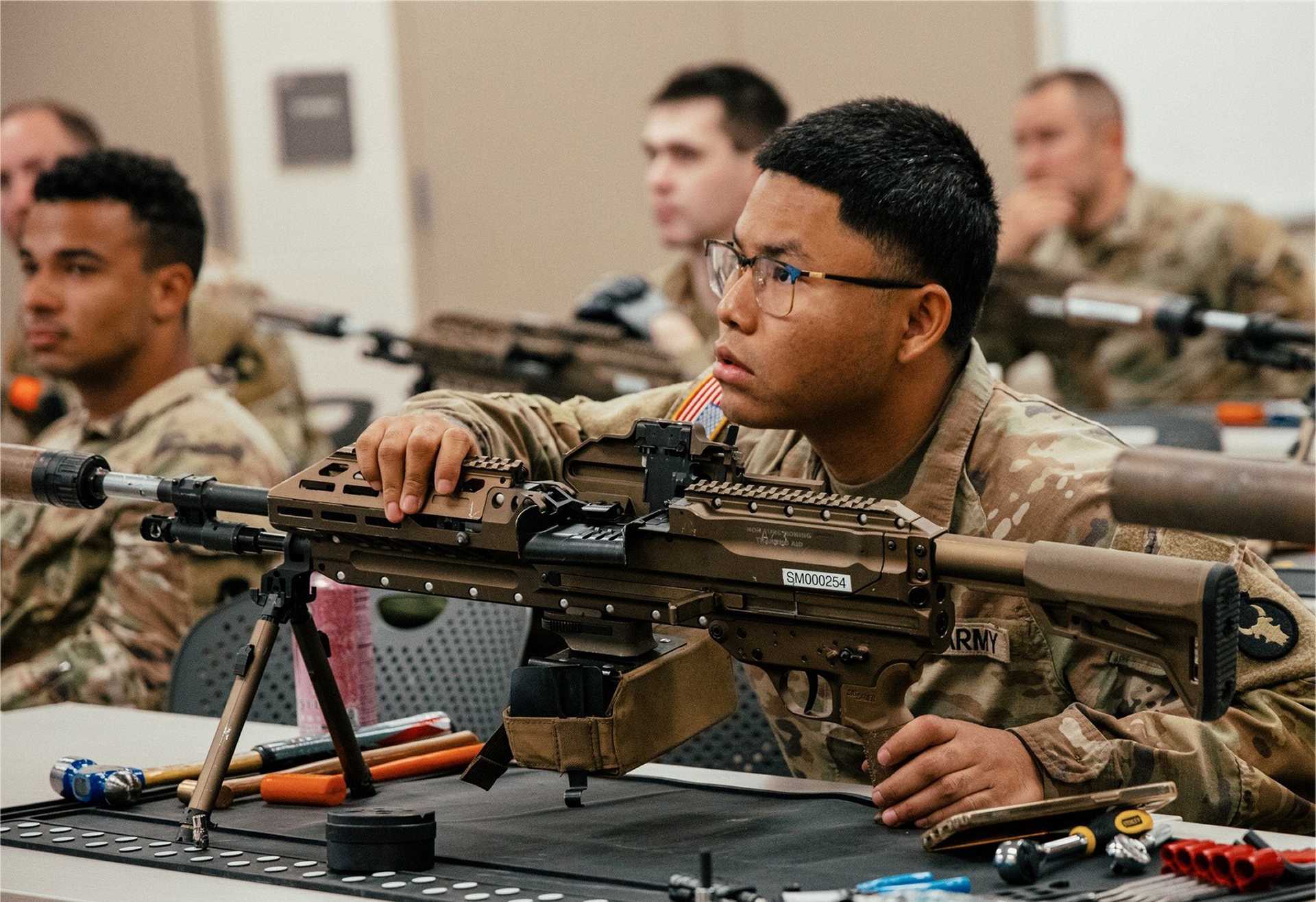U.S. Soldiers from the U.S. Army’s 34th Infantry Division receive hands-on training with the new M250 automatic rifle during a New Equipment Training session at Camp Ripley, Minnesota, on September 15, 2025.