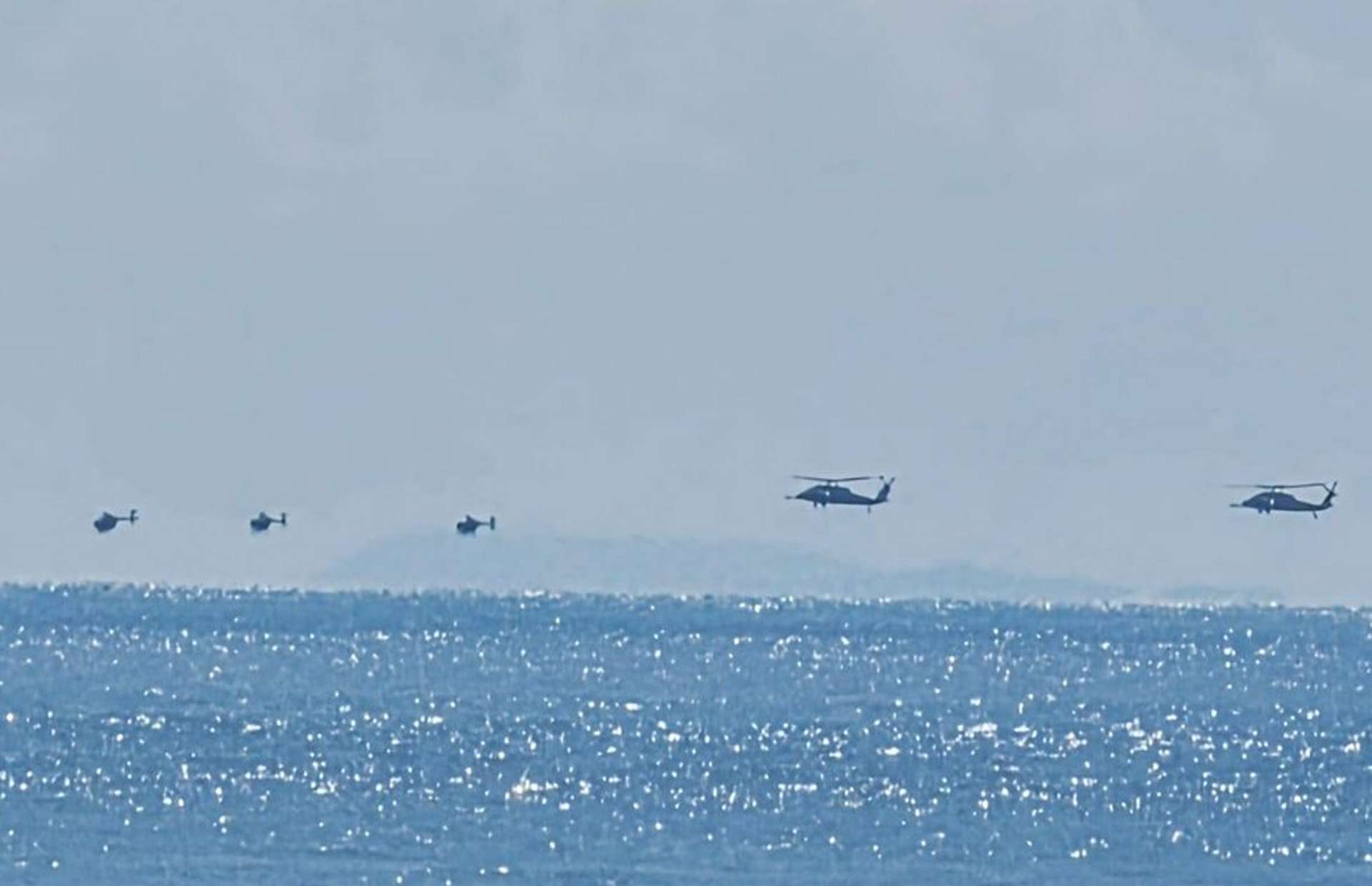 Night Stalker MH-60s and MH-6s operate near Venezuela with a B-52 overhead and MV Ocean Trader at sea, boosting counter-narcotics reach and rapid raid options (Picture source: Abby Karim on social media).