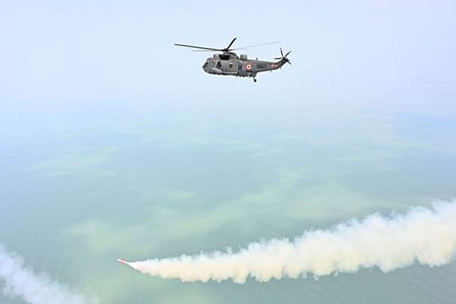 Indian Navy Sea King helicopter launches DRDO’s NASM-SR anti-ship missile during a successful maiden salvo test off Odisha, validating India’s indigenous air-launched maritime strike capability with precision waterline hit performance (Picture source: Indian MoD).
