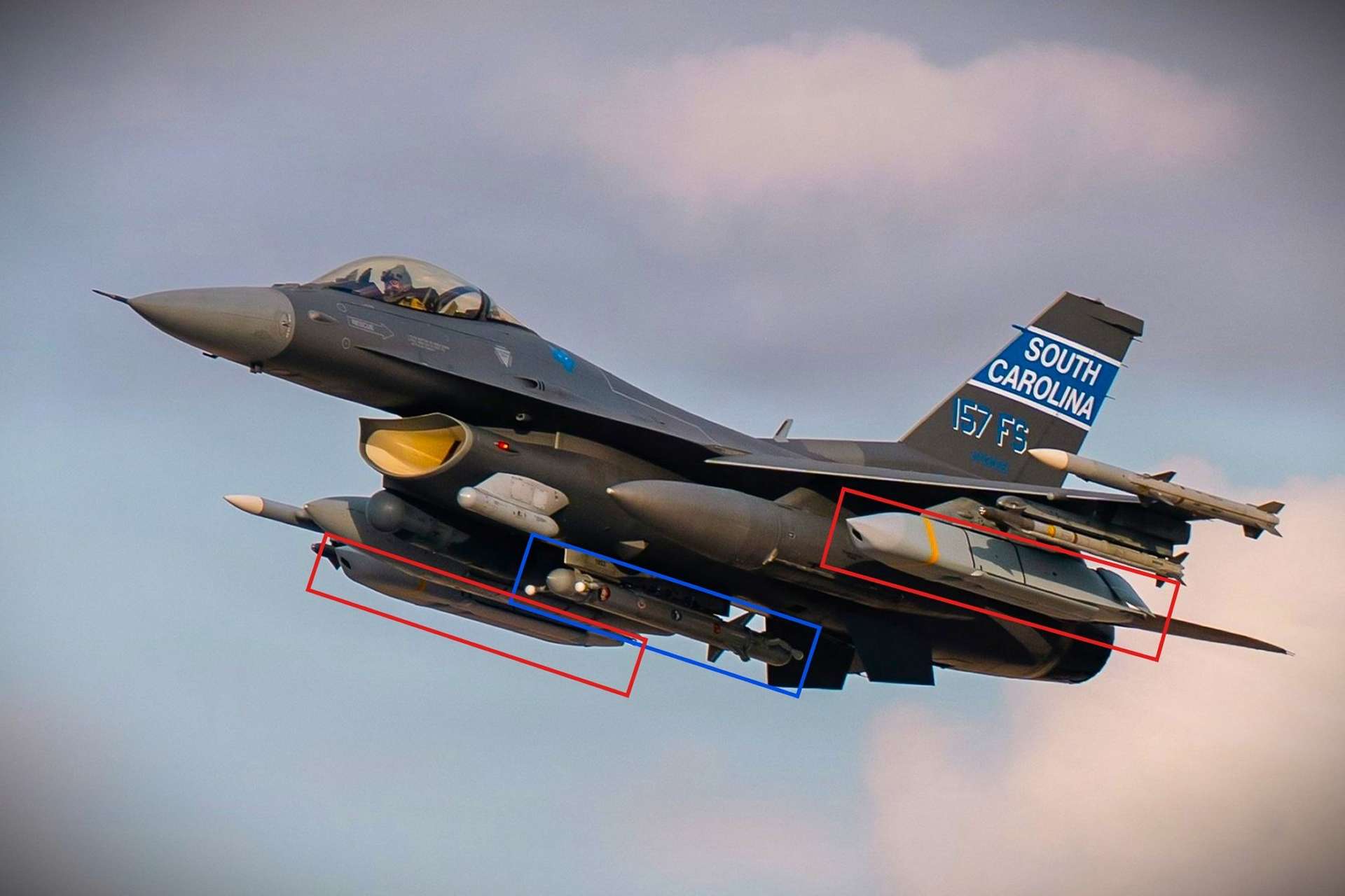 A newly released Operation Epic Fury image appears to show a U.S. Air Force F-16 Fighting Falcon configured with AGM-158 JASSM missiles and an Angry Kitten electronic warfare pod, indicating a self-escorting standoff strike role in a contested air-defense environment near Iran (Picture Source: U.S. Air Force)