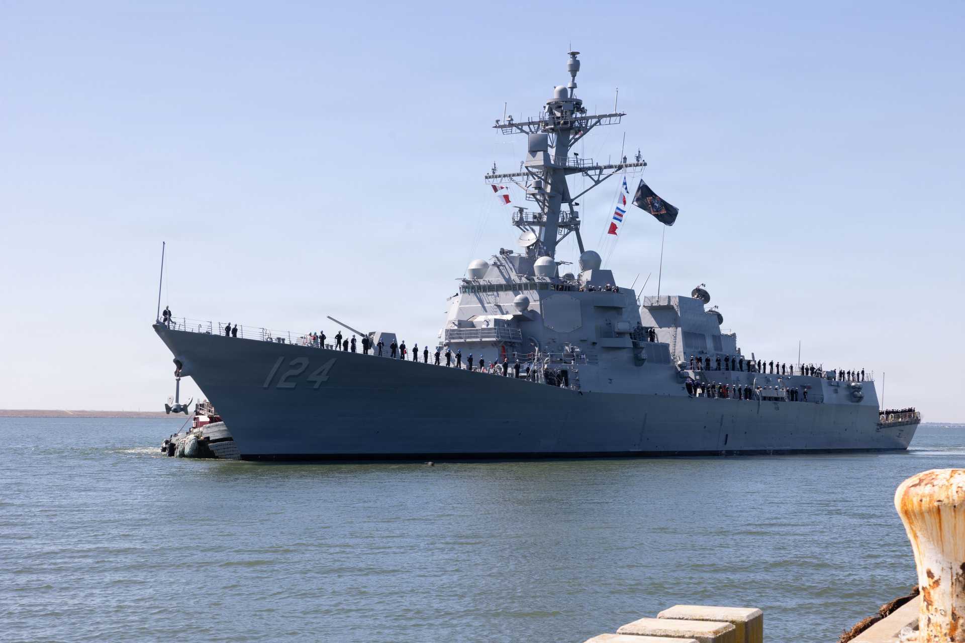 USS Harvey C. Barnum Jr. (DDG 124), a Flight IIA Arleigh Burke-class guided-missile destroyer, underway during post-commissioning operations, showcasing its AN/SPY-1D(V) Aegis radar arrays and 96-cell Mk 41 Vertical Launch System configured for integrated air and missile defense, long-range strike, and anti-submarine warfare missions within U.S. Navy distributed maritime operations.