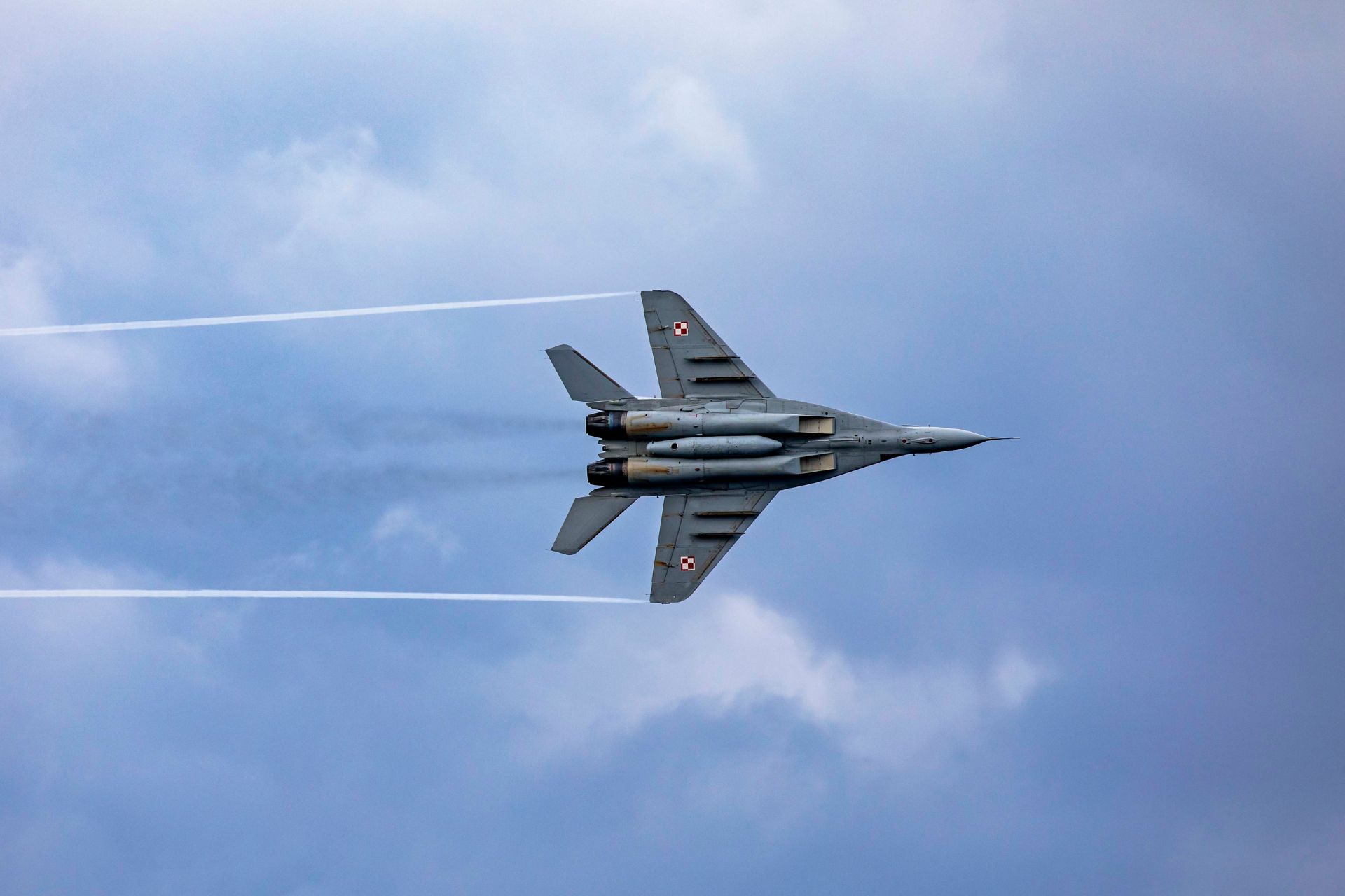A Polish MiG-29 flies over the Arleigh Burke-class guided-missile destroyer USS Porter during a cooperative exercise with the Polish Navy, March 14, 2023 (Picture source: US DoD)