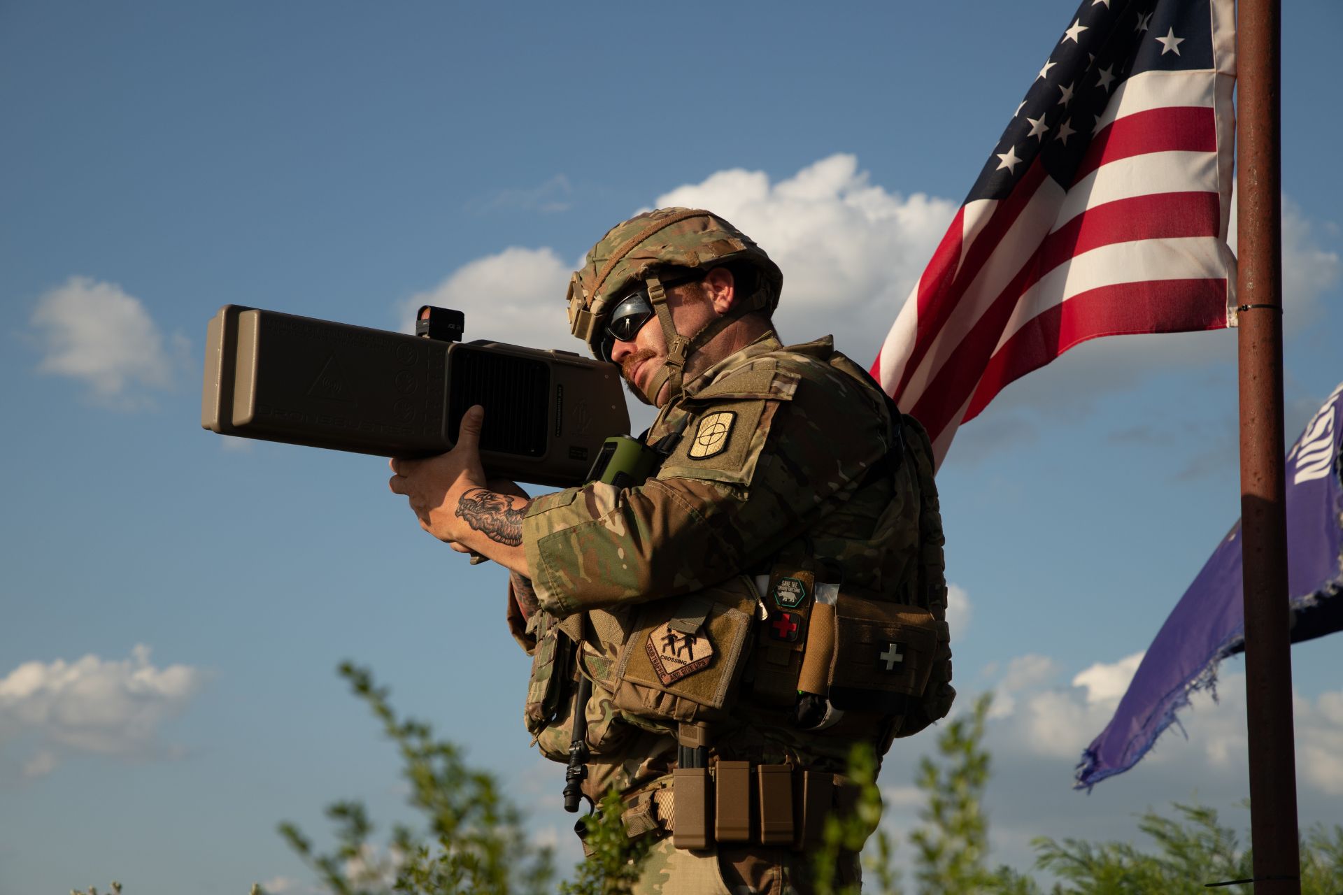 U.S. Army Staff Sgt. Kristopher Runyon operates a Dronebuster Counter-Small Unmanned Aircraft System during a patrol near Eagle Pass, Texas, on June 14, 2025. U.S. Northern Command has warned that current sensor and effector coverage remains insufficient to counter drone swarm attacks across the homeland. (Picture source: US DoD)