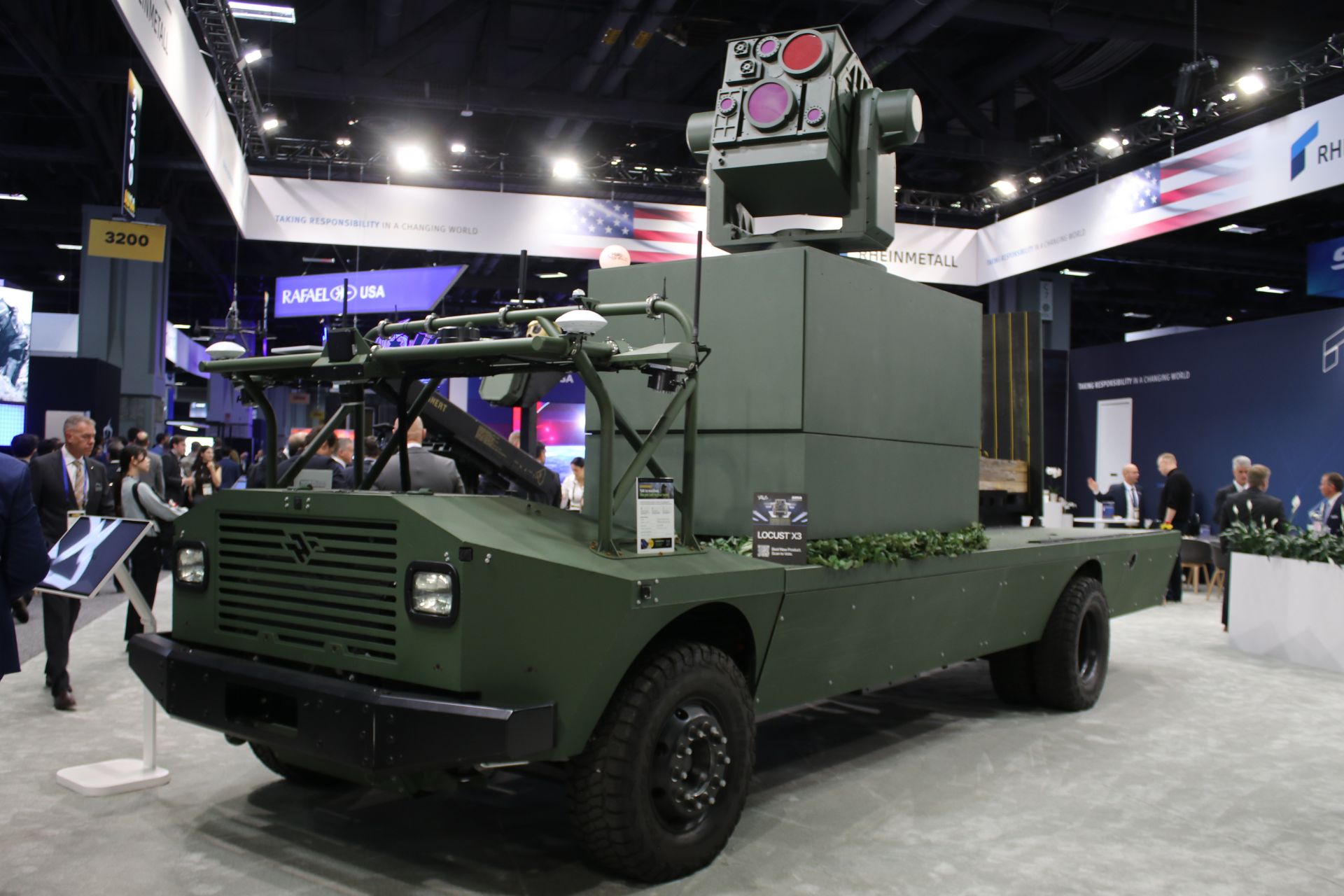 AeroVironment's LOCUST X3 high-energy laser counter-drone system mounted on American Rheinmetall's MUSKOX unmanned ground vehicle at AUSA 2026 in Washington, D.C., October 12, 2026. (Picture source: Army Recognition)