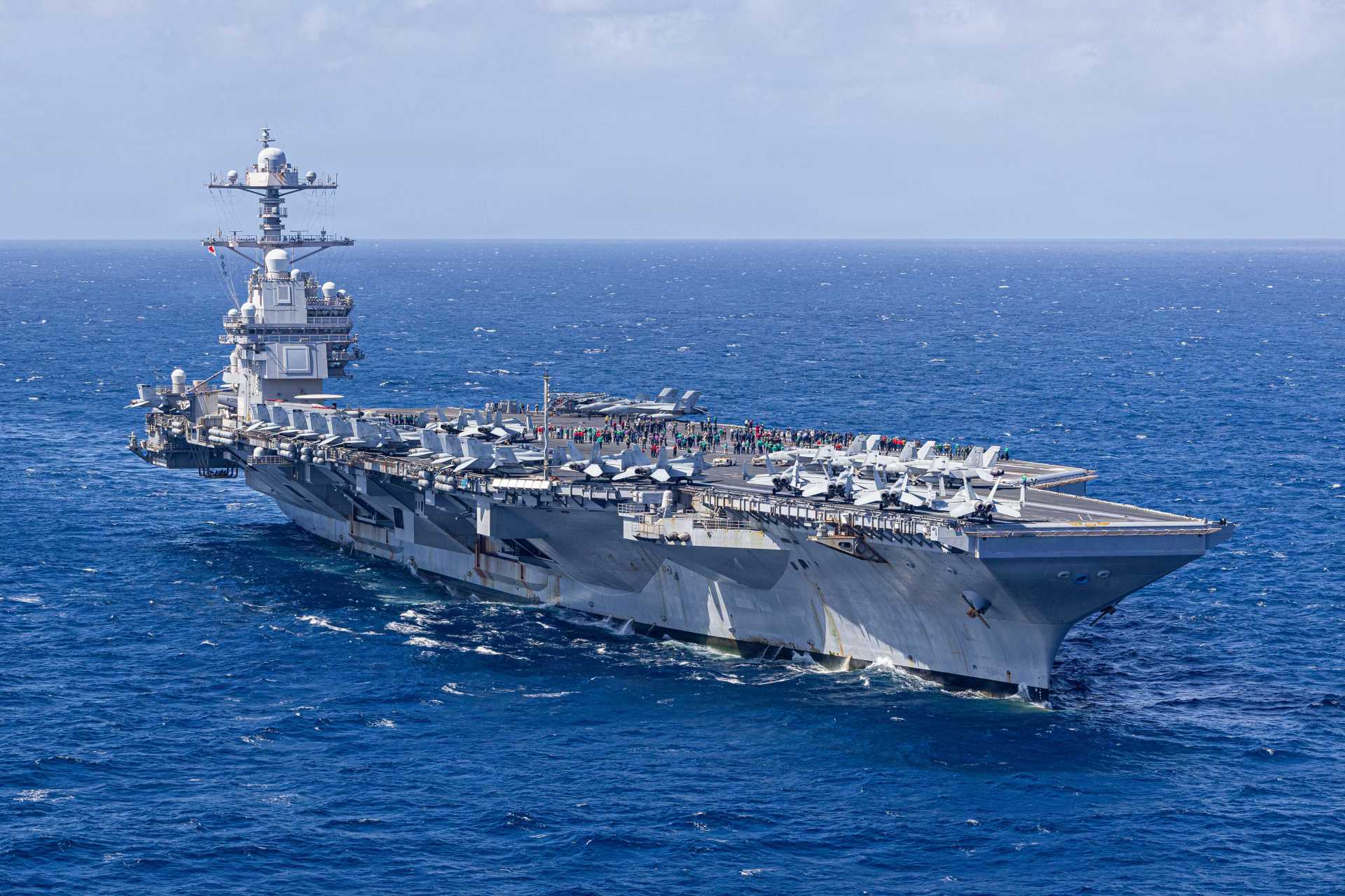 USS Gerald R. Ford (CVN-78), the lead ship of the Ford-class supercarriers and the U.S. Navy’s most advanced warship, demonstrates its global combat reach during recent operations, including a high-tempo deployment in the Caribbean as part of Operation Southern Spear before redeploying toward the Middle East amid rising tensions with Iran.