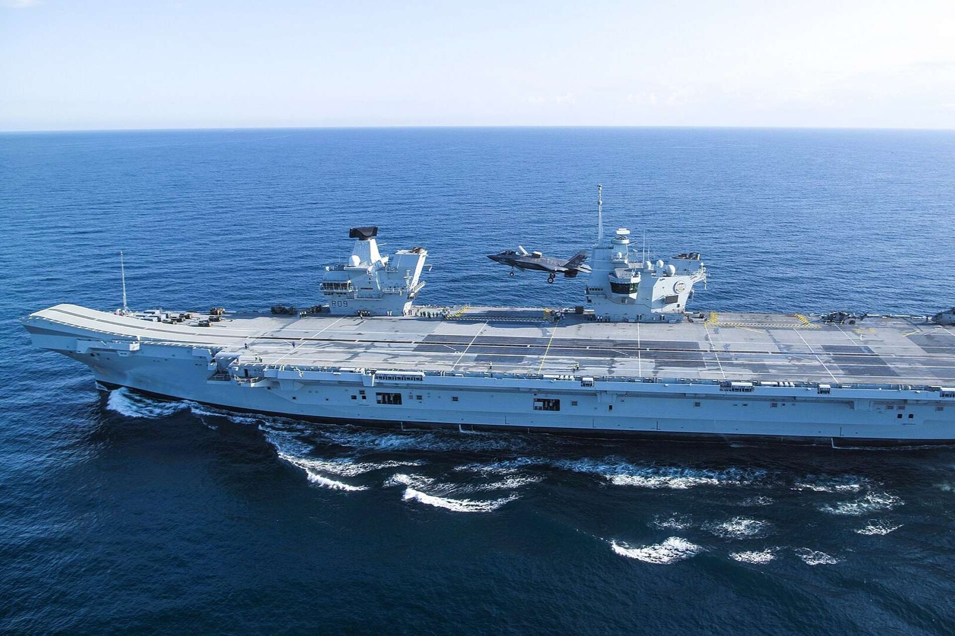 The UK Ministry of Defence has confirmed that HMS Prince of Wales will lead a Carrier Strike Group across the North Atlantic and High North in 2026 under Operation Firecrest, reinforcing NATO deterrence amid heightened Russian maritime activity and growing concern over critical undersea infrastructure (Picture Source: Royal British Navy)