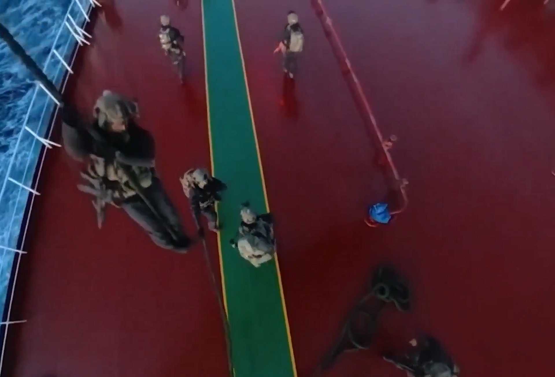 French Commandos Marine fast‑rope from a French Navy helicopter during a maritime boarding operation against a Russian‑linked oil tanker in the Mediterranean Sea, illustrating France’s naval special forces capability to conduct high‑risk interdiction missions at sea.