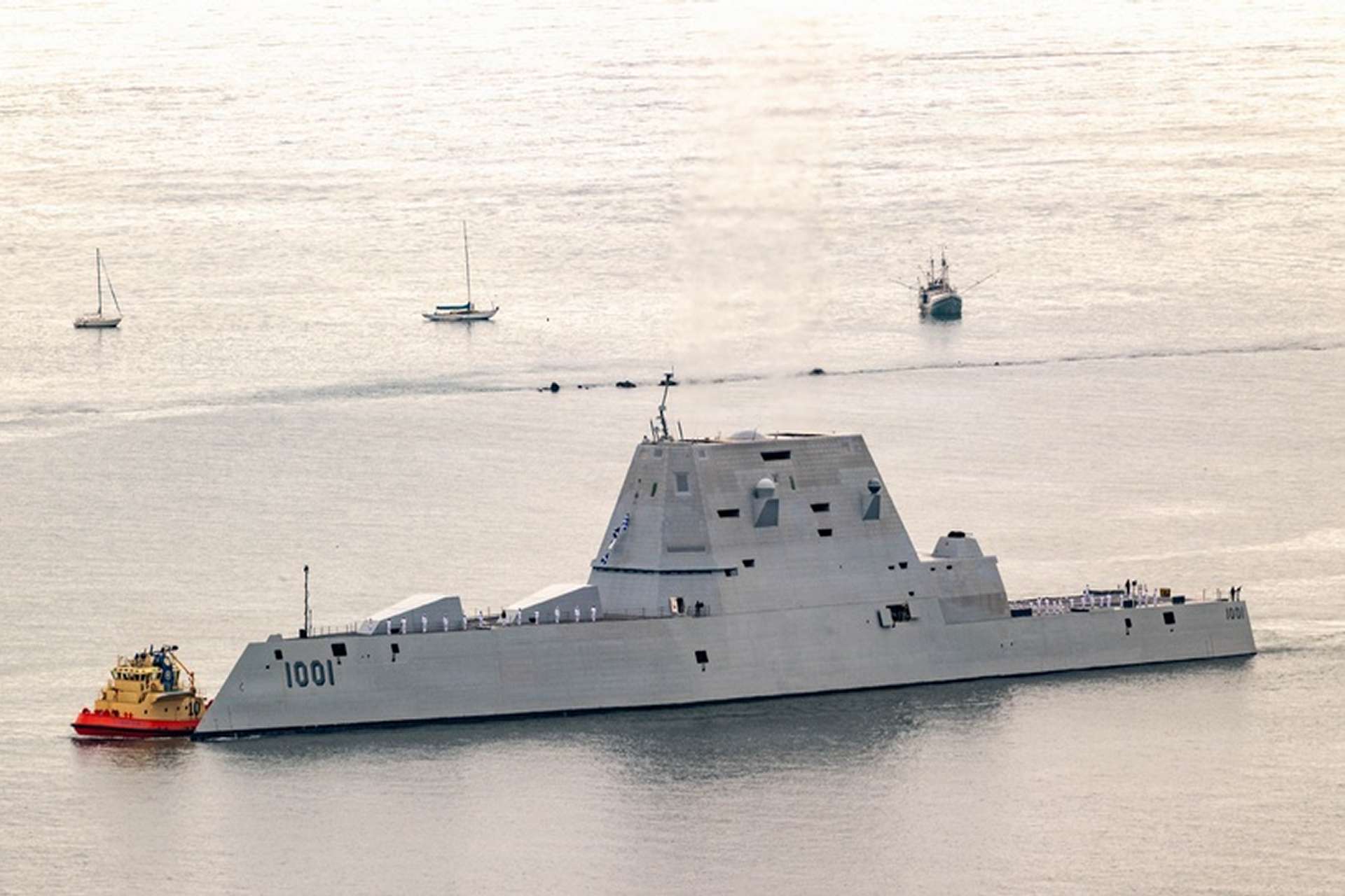 USS Zumwalt is undergoing a $2 billion-class modernization to carry up to 12 Conventional Prompt Strike hypersonic missiles, but ship integration, testing, and missile-production delays have pushed the first sea-launched test to fiscal year 2027 (Picture source: U.S. DoW).