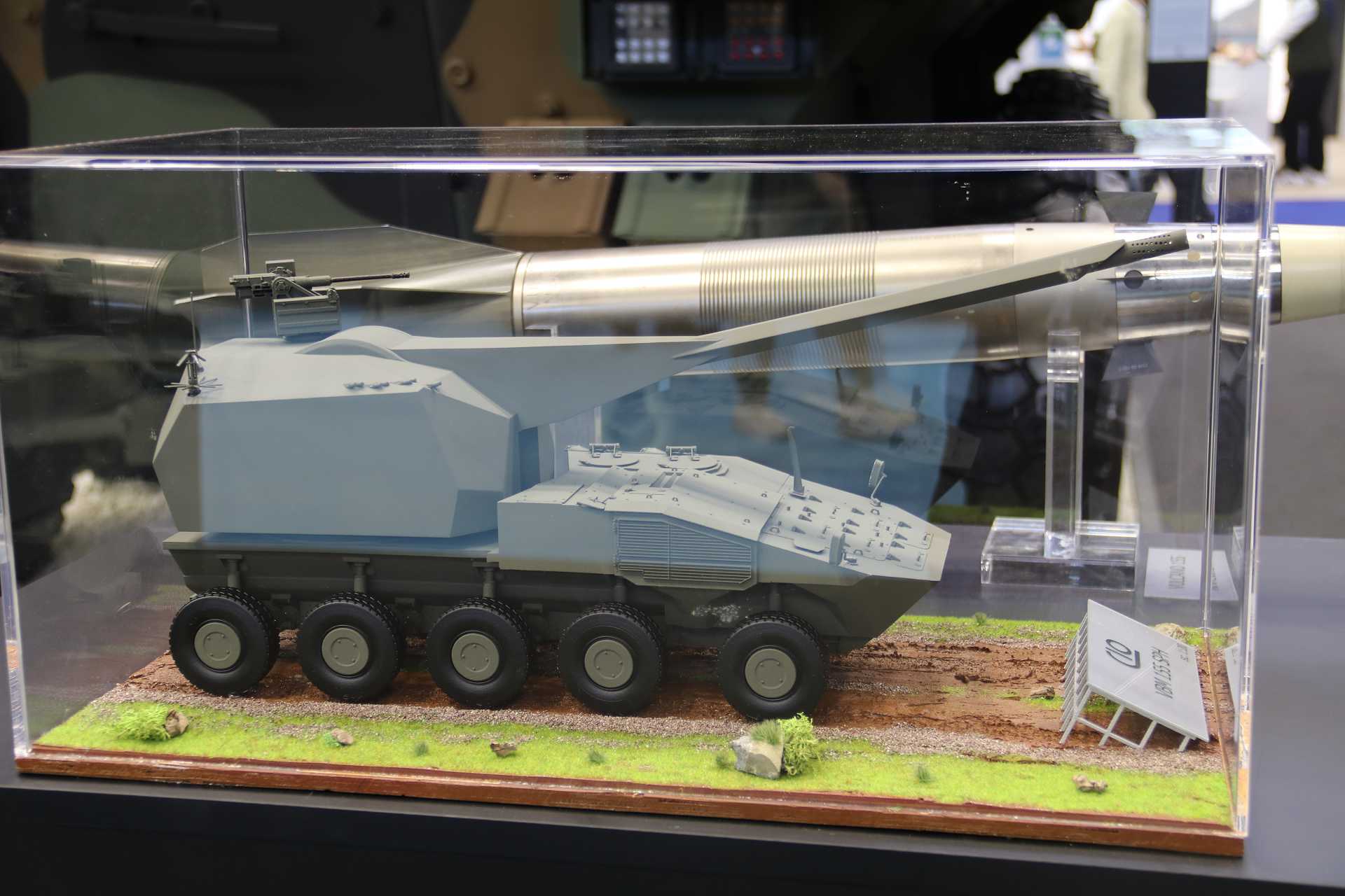 Scale model of the VBM 155 SPH 10x10 wheeled self-propelled howitzer displayed by Iveco Defence Vehicles and CIO at Eurosatory 2026 in Paris France.