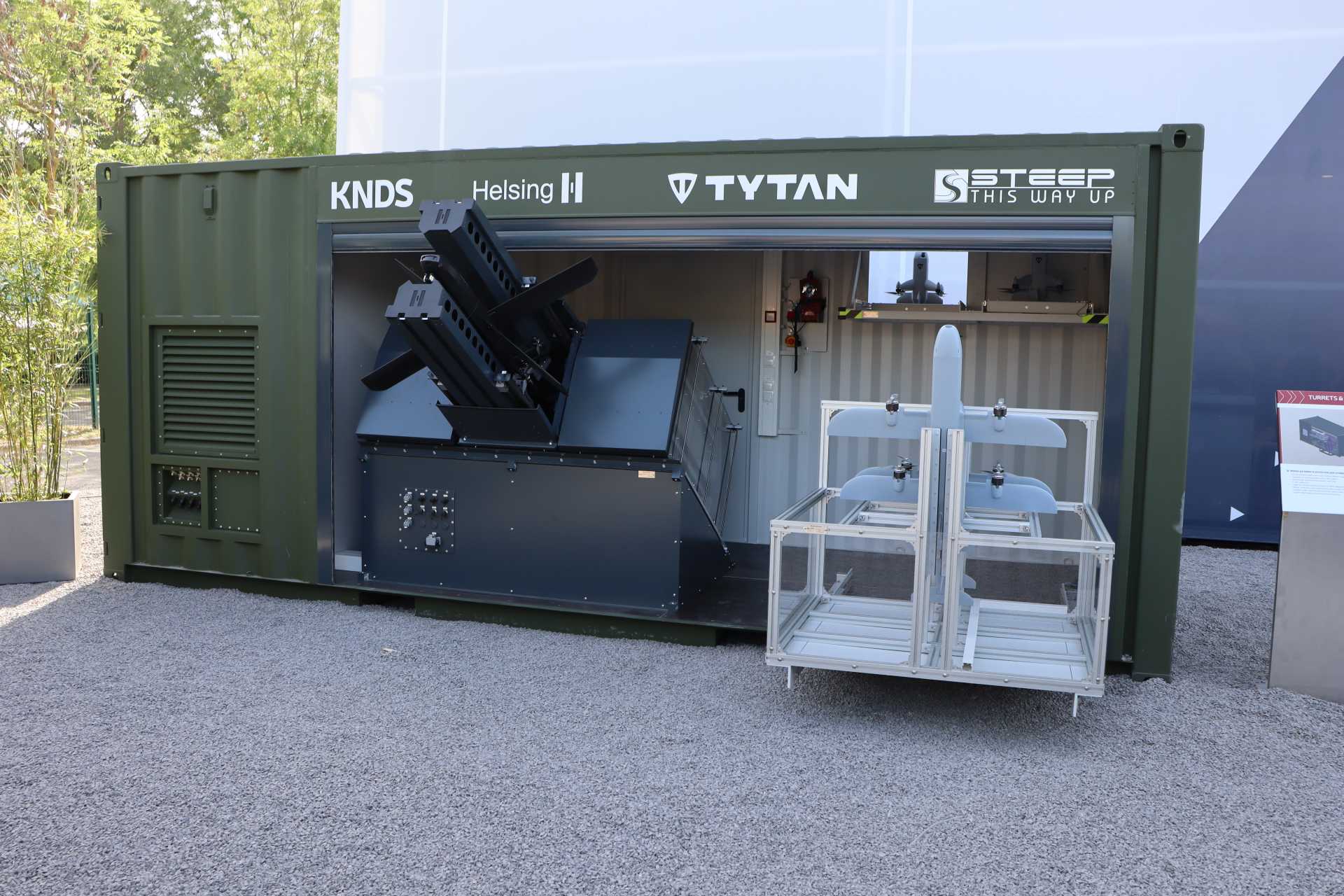 The mock-up demonstrator of KNDS integrated both Helsing HX-2 loitering strike drones and Tytan TI-1 METIS interceptor drones to combine offensive and local air defense functions within a single launch container. (Picture source: Army Recognition)