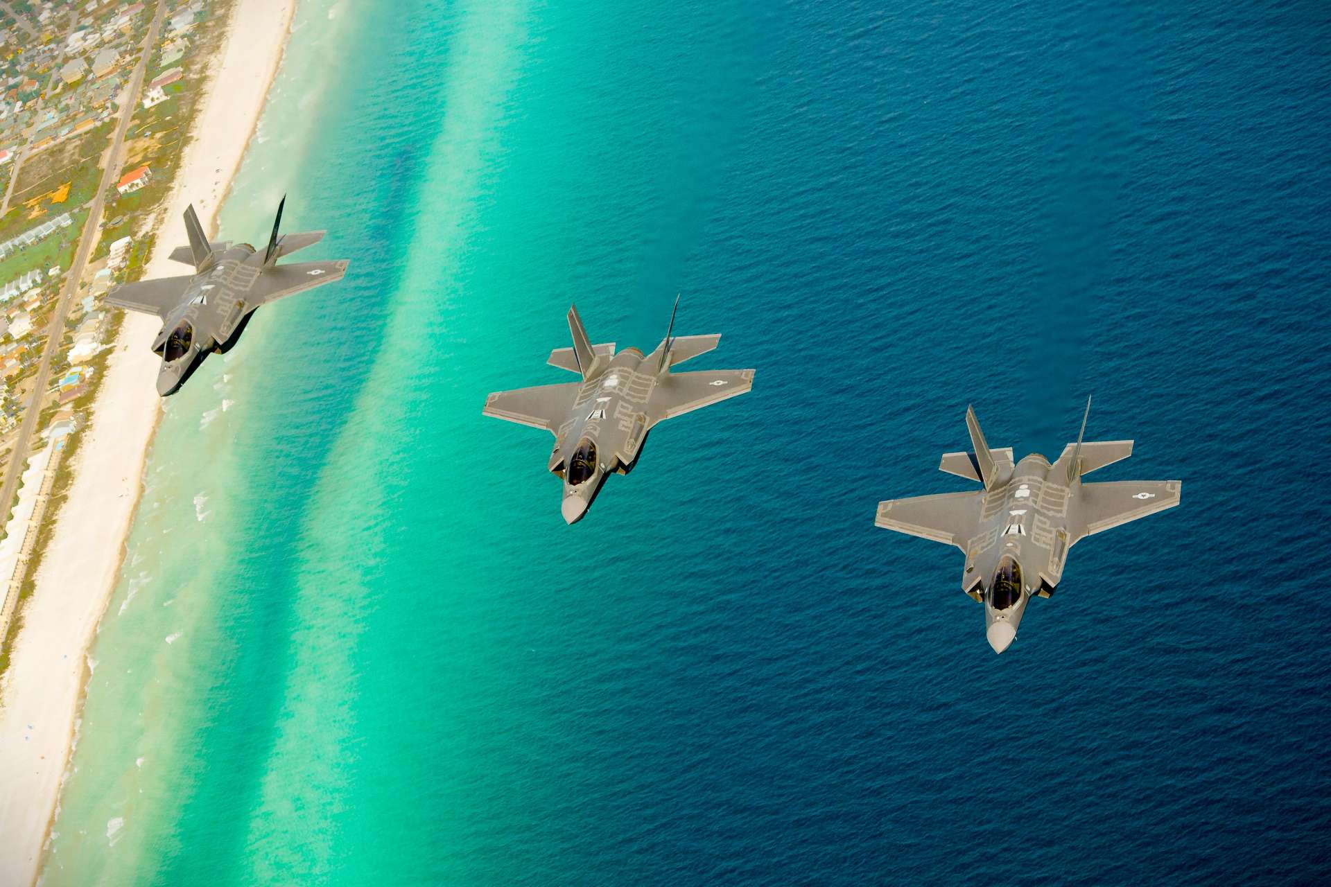 Three U.S. Air Force F-35A Lightning II aircraft from the 58th Fighter Squadron fly in formation over Florida during a 2013 training mission at Eglin Air Force Base, home to the F-35 Integrated Training Center, this image is for illustrative purposes (Picture Source: U.S. Air Force)