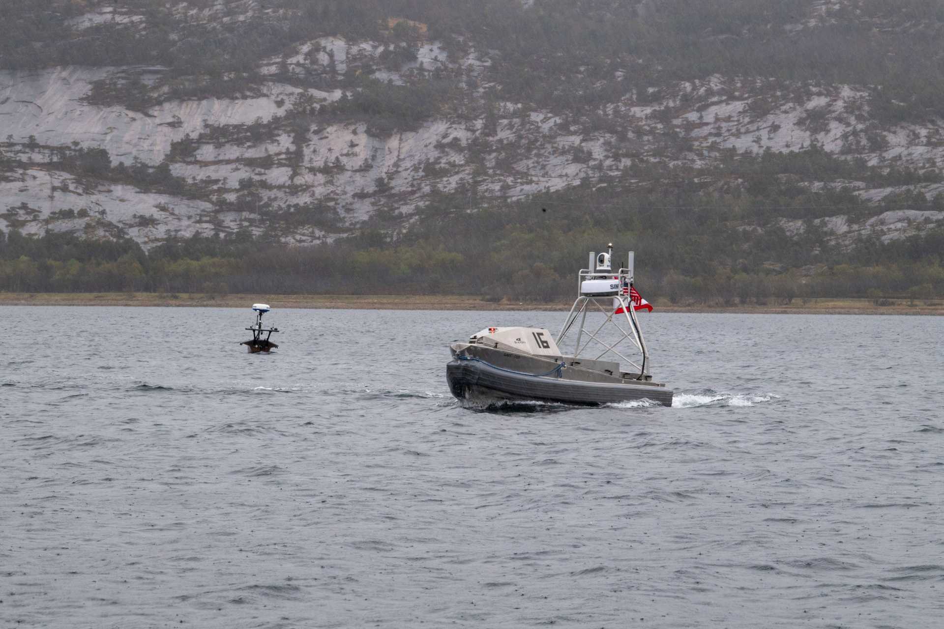 A Global Autonomous Reconnaissance Craft assigned to Commander, Task Force 66 operates in Breivika Bay during Arctic Sentry 2026, supporting U.S.-Norwegian unmanned maritime operations in the High North.